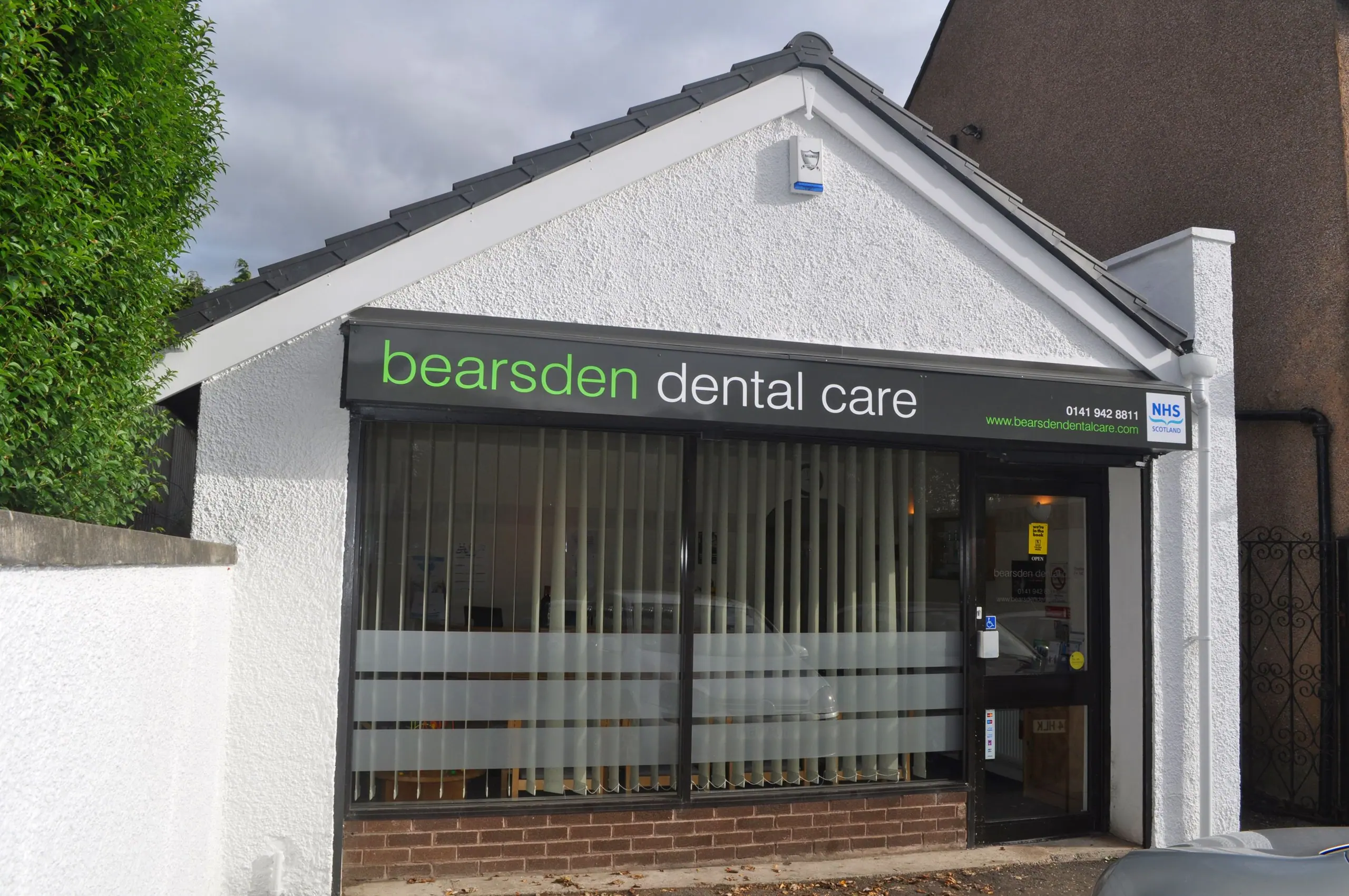 The front of Bearsden Dental Care on Ledi Drive, with its green sign