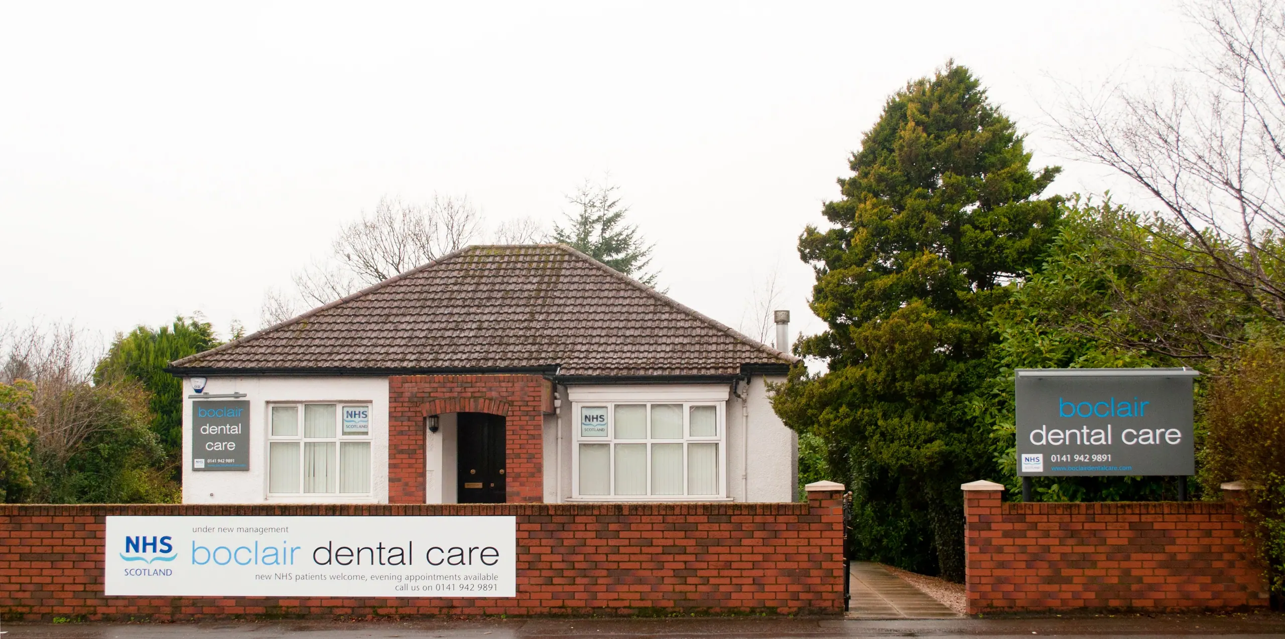 Boclair Dental Care on Milngavie Road, with its sign and parking